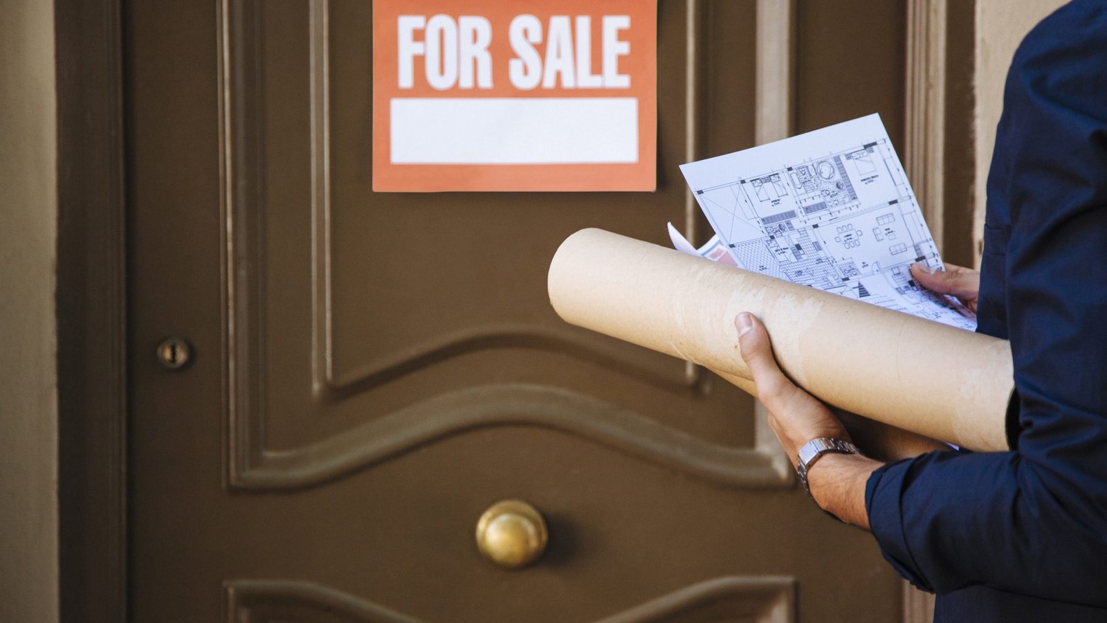 real-estate-agent-front-door-with-sale-sign